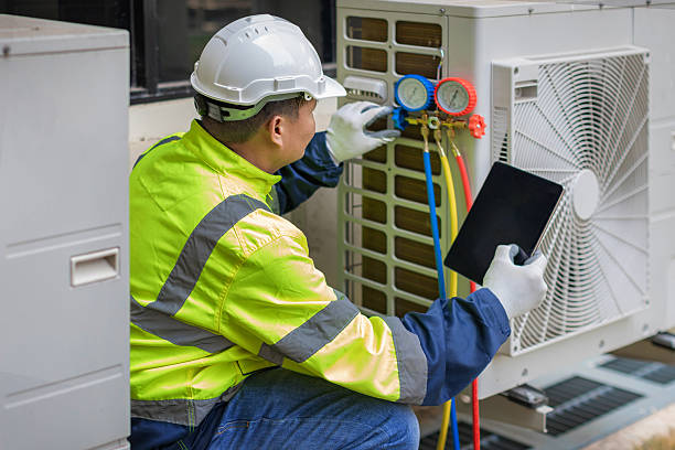 Professional Heat Pump Repair technician working in Rockdale, TX